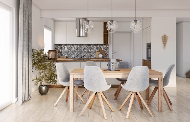 Strefa dzienna w jasnych kolorach i z odcieniami szarości, z dodatkiem drewnianych elementów